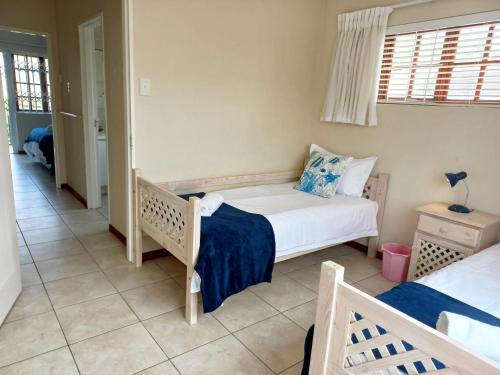a bedroom with two beds in a room at 61 Settler Sands - Beach apartment in Port Alfred