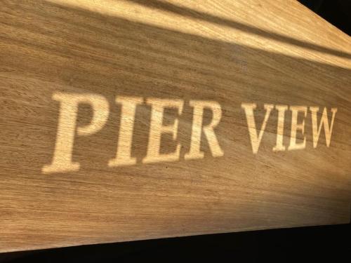 a wooden sign with the word pitch way on it at Pier View 2 Bedroom Apartment in Cowes