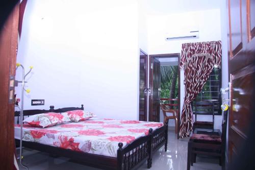 A bed or beds in a room at Prems Homestay