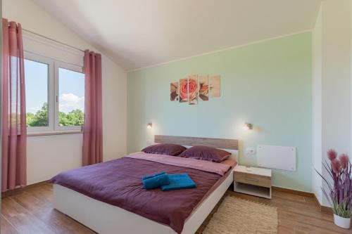 Postel nebo postele na pokoji v ubytování Villa Lena
