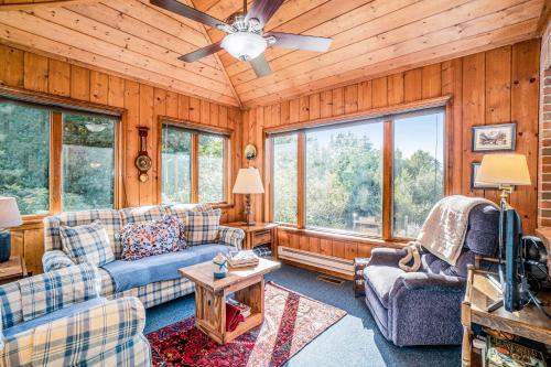 a living room with couches and a ceiling fan at Hidden Gem in Arcadia