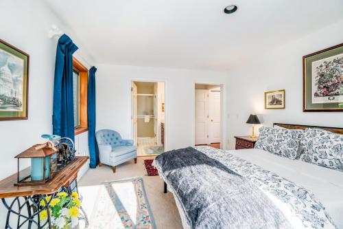 a bedroom with a bed and a chair at Hidden Gem in Arcadia