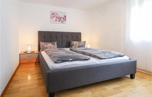 a bedroom with a bed with a headboard at Amazing Apartment In Dalaas With Wifi in Dalaas