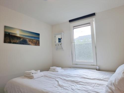 Postel nebo postele na pokoji v ubytování Vakantiehuis met Sauna Oostkapelle OK17