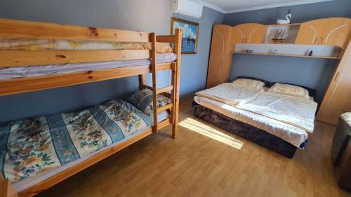 A bed or beds in a room at Holiday home in Balatonmariafürdo 43119