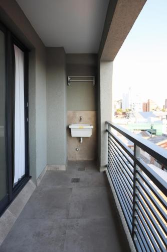 a bathroom with a sink on a balcony at GARAY 29- Depto un dormitorio in Santa Fe