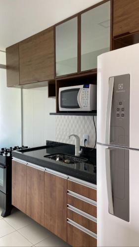 Η κουζίνα ή μικρή κουζίνα στο Atlântico condomínio