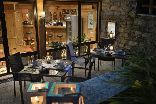 a group of tables and chairs in a restaurant at Hotel Valtellina in Livigno