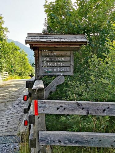 a sign on the side of a road at Ferienwohnungen Birkleiten in Bramberg am Wildkogel