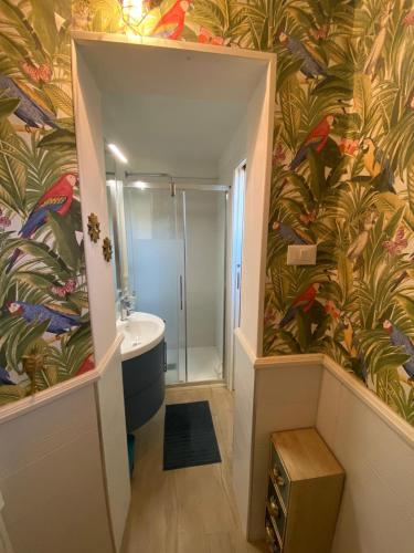 a bathroom with a shower and a toilet and a sink at Perla Blu in Viareggio