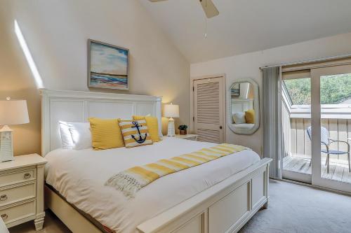 a bedroom with a large bed and a window at Isle of Pines in Hilton Head Island