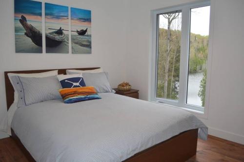 Postel nebo postele na pokoji v ubytování Chalet Nordique