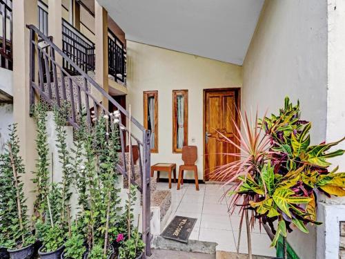 a house with plants on the side of it at Adinda Homestay Lembang in Lembang