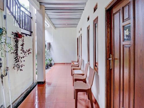 a hallway with a row of chairs in a building at Adinda Homestay Lembang in Lembang