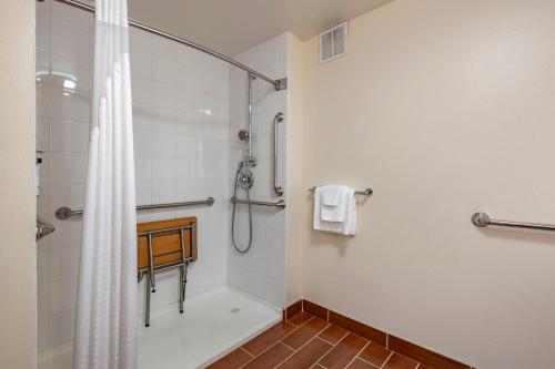 a bathroom with a shower with a shower curtain at Holiday Inn Bangor by IHG in Bangor