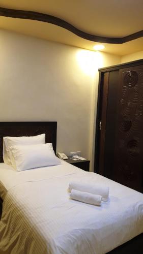 Muscat Horizon Hotelにあるベッド