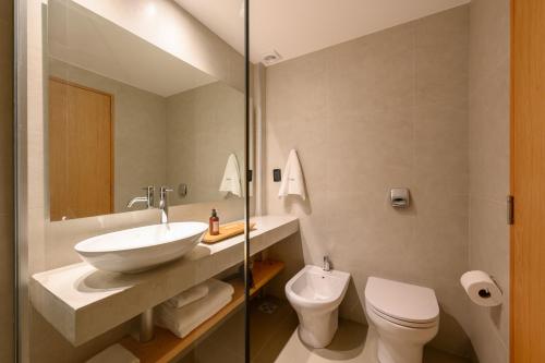 a bathroom with a sink and a toilet at Ambar Hotel in Punta del Este