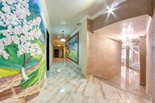 a hallway with a painting on the wall at Mountain Krystal in Bukovel