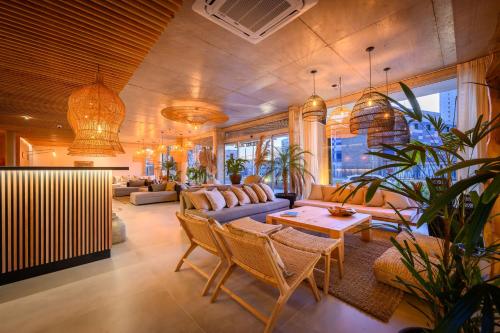 a living room with a couch and a table at Ambar Hotel in Punta del Este