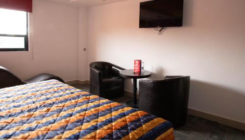Hotel Rossel Plaza tesisinde bir odada yatak veya yataklar