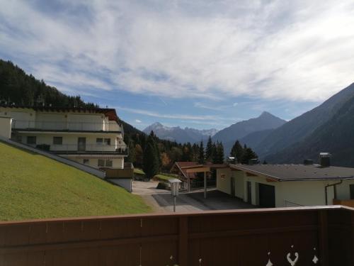 a view from the balcony of a building with mountains in the background at Haus Dristner in Tux