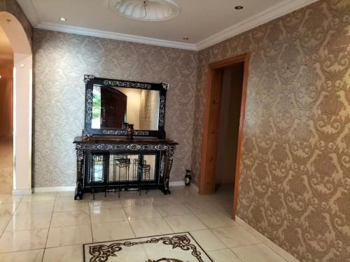 a room with a mirror and a tile floor at Villa Marmara in Al Madinah