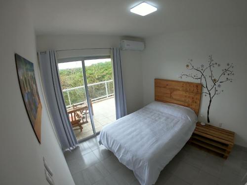 Postel nebo postele na pokoji v ubytování Boca PentHouses - Tampiquera
