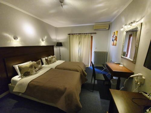 A bed or beds in a room at Liknon