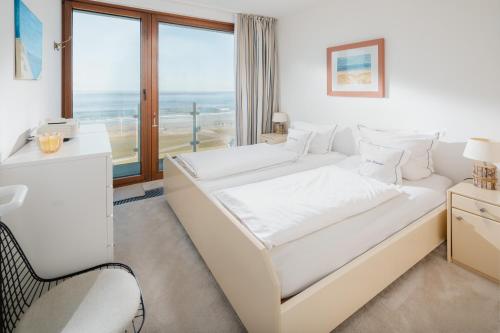 Postel nebo postele na pokoji v ubytování Kaiserblick Norderney