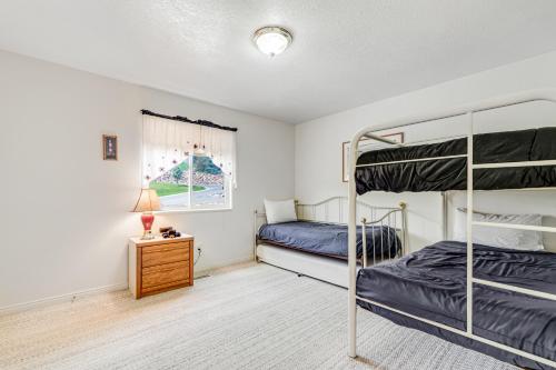 a bedroom with two bunk beds and a lamp at Marina Retreat in Garden City