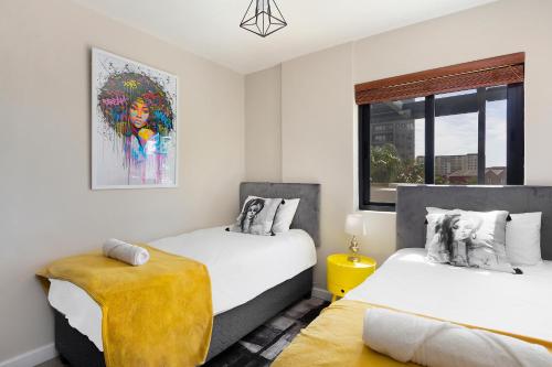 Un pat sau paturi într-o cameră la Knightsbridge Terrace