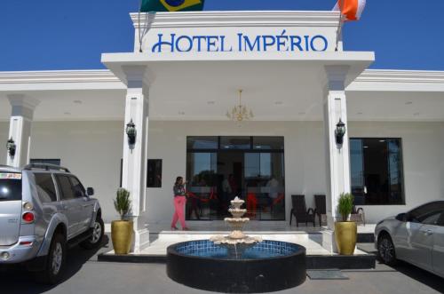 a man standing in front of a hotel imperatio at HOTEL IMPERIO in Aparecida do Taboado