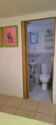 a bathroom with a toilet and a sink at Studio 5 min from the beach in Kas Chikitu