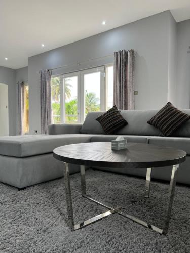 a living room with a couch and a coffee table at Belle Luxury Apartments in Gros Islet