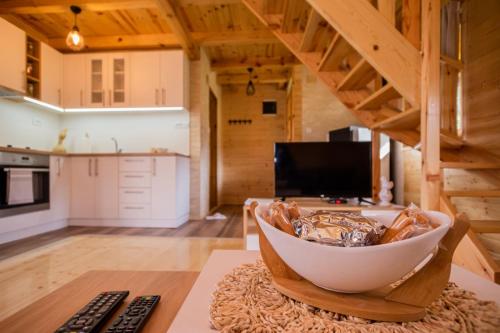 a kitchen with a large white bowl on a table at Brvnara Oganj in Čajetina