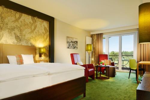 
Ein Bett oder Betten in einem Zimmer der Unterkunft Romantik Hotel Jagdhaus Eiden am See
