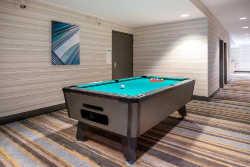 a billiard room with a pool table at Holiday Inn Poughkeepsie by IHG in Poughkeepsie