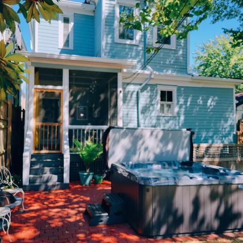 a hot tub on a patio in front of a house at B&B Zia Gianna in Savannah