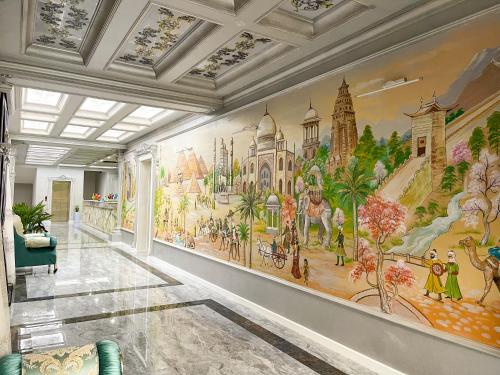 a hallway with a large mural on the wall at Medina Hotel Samarkand in Samarkand