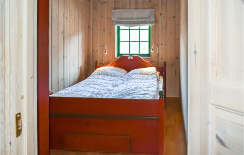 a small bed in a room with a window at Lovely Home In Hemsedal With Wifi in Hemsedal