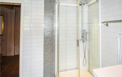 a shower with a glass door in a bathroom at Lovely Home In Hemsedal With Wifi in Hemsedal