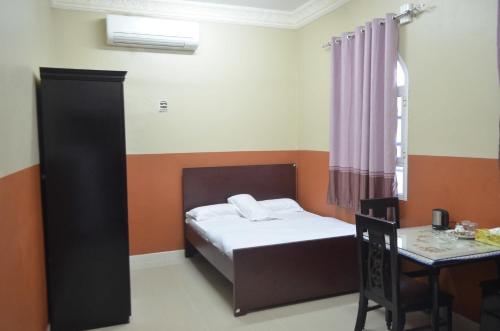 Postel nebo postele na pokoji v ubytování Five Continents Hotel