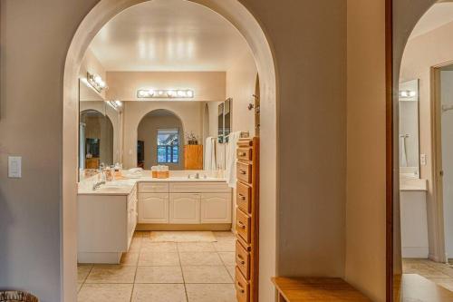 a bathroom with a sink and a large mirror at PRIME Uptown Location- Mountain View- Kid Friendly - Sleeps 10 in Sedona