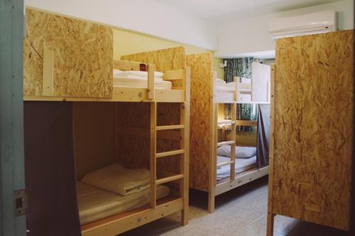 a group of bunk beds in a room at South Talk B&B in Hengchun