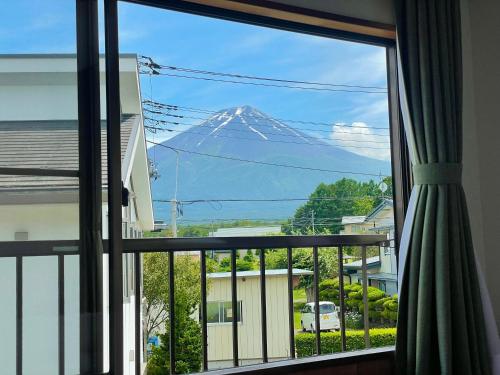 a view of a mountain from a window at 富士旅の家 in Fujikawaguchiko