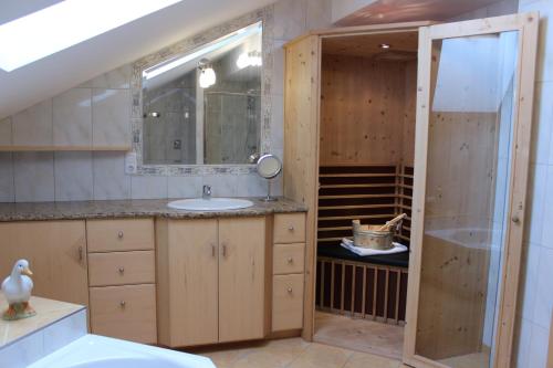 a bathroom with a sink and a mirror at Apartment Graber in Krimml