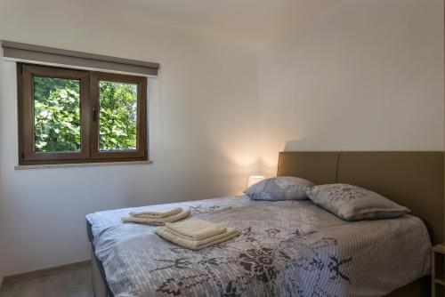 Ένα ή περισσότερα κρεβάτια σε δωμάτιο στο Villa Irma