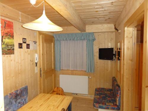 Una televisión o centro de entretenimiento en Appartement Agostini