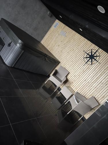 an overhead view of chairs and a table and a boat on the floor at Penthouse Style Luxury 2 Bedroom House has Hot-Tub, extra fees apply in Birmingham