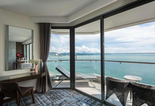 a room with a view of the ocean at Queen Ann Nha Trang Hotel in Nha Trang